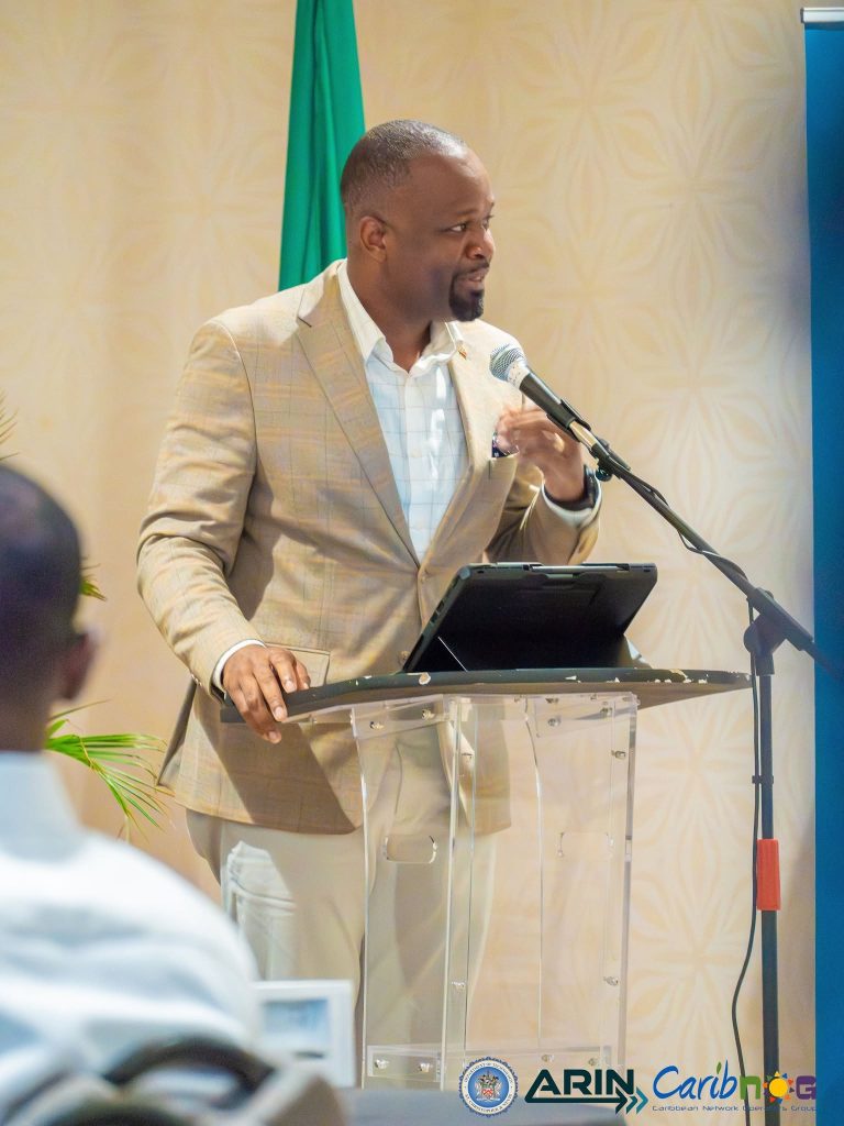 A speaker addressing participants at the ARIN and CaribNOG seminar in St. Kitts
