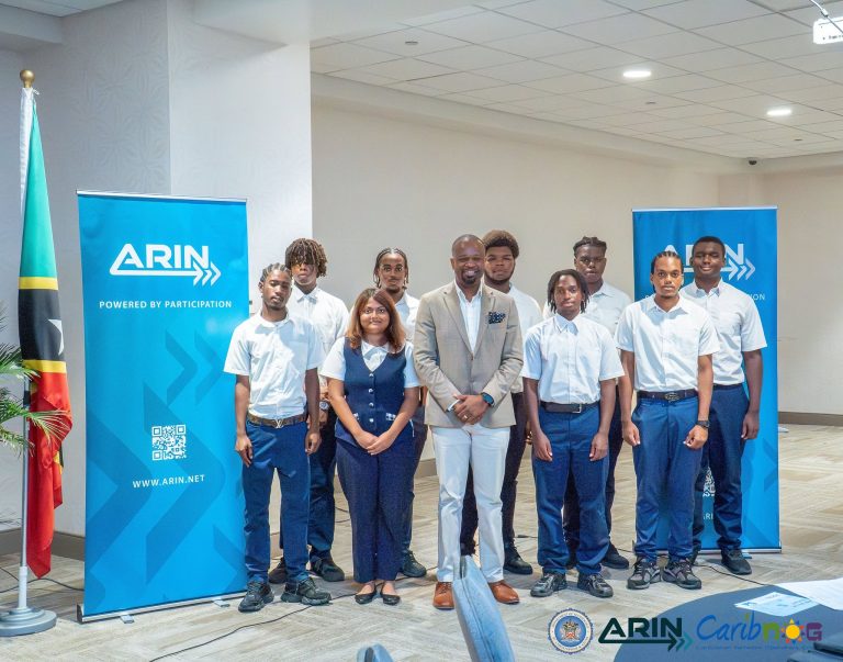 Student participants with ARIN banners at the ARIN and CaribNOG seminar in St. Kitts