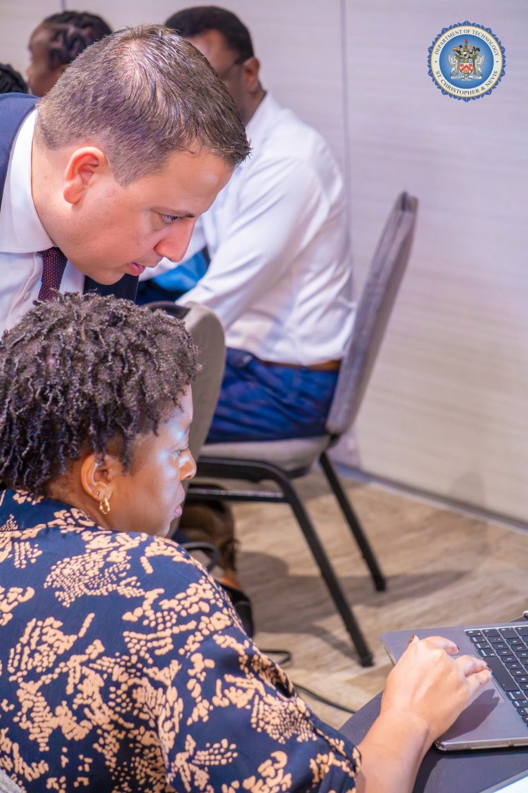 Participant listening during a session at the cybersecurity workshop in St. Kitts, October 2026