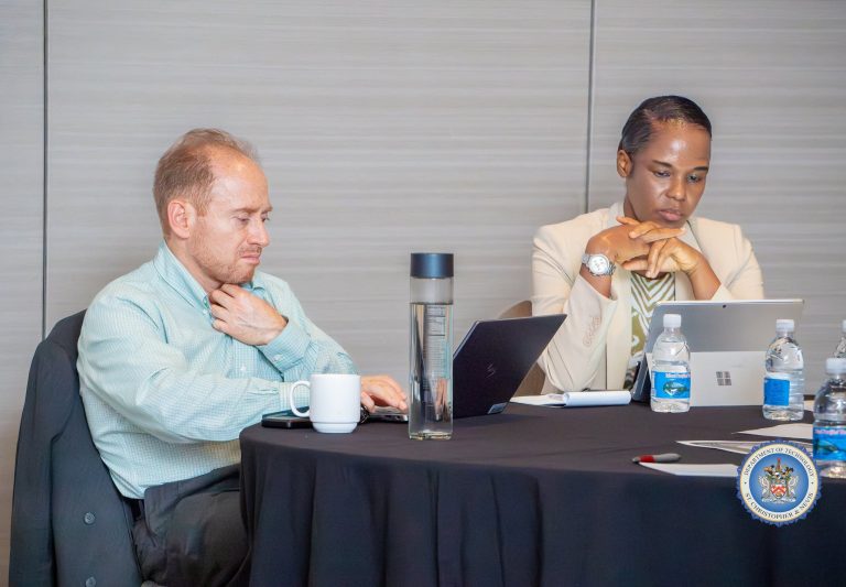 Participants following a session at their table at the cybersecurity workshop in St. Kitts, October 2026